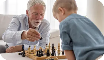 Two adults playing a focused game of chess
